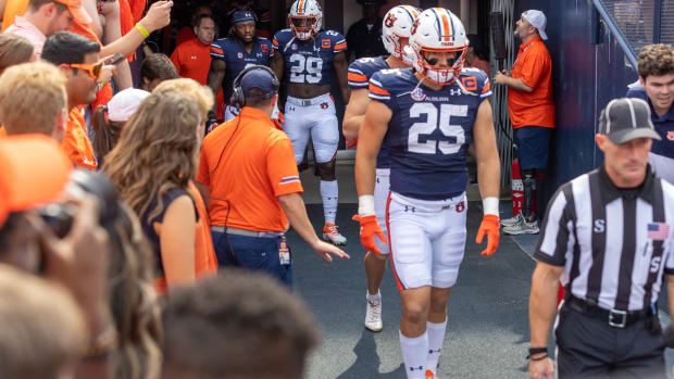 John Samuel Shenker approaching the field.